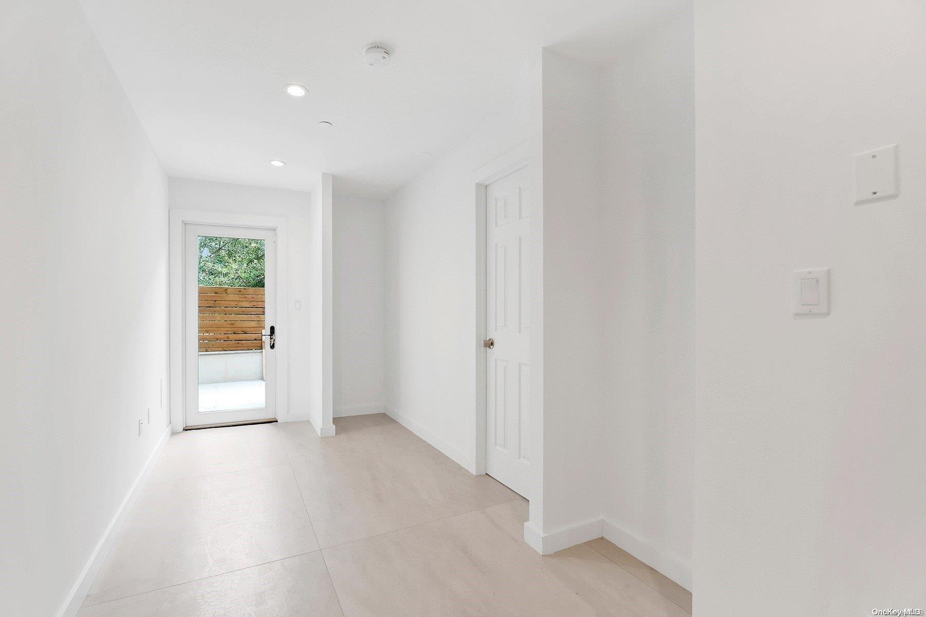 1511 Pacific Street Brooklyn, NY 11213 - Photo 11 of 31 a view of an empty room and a window