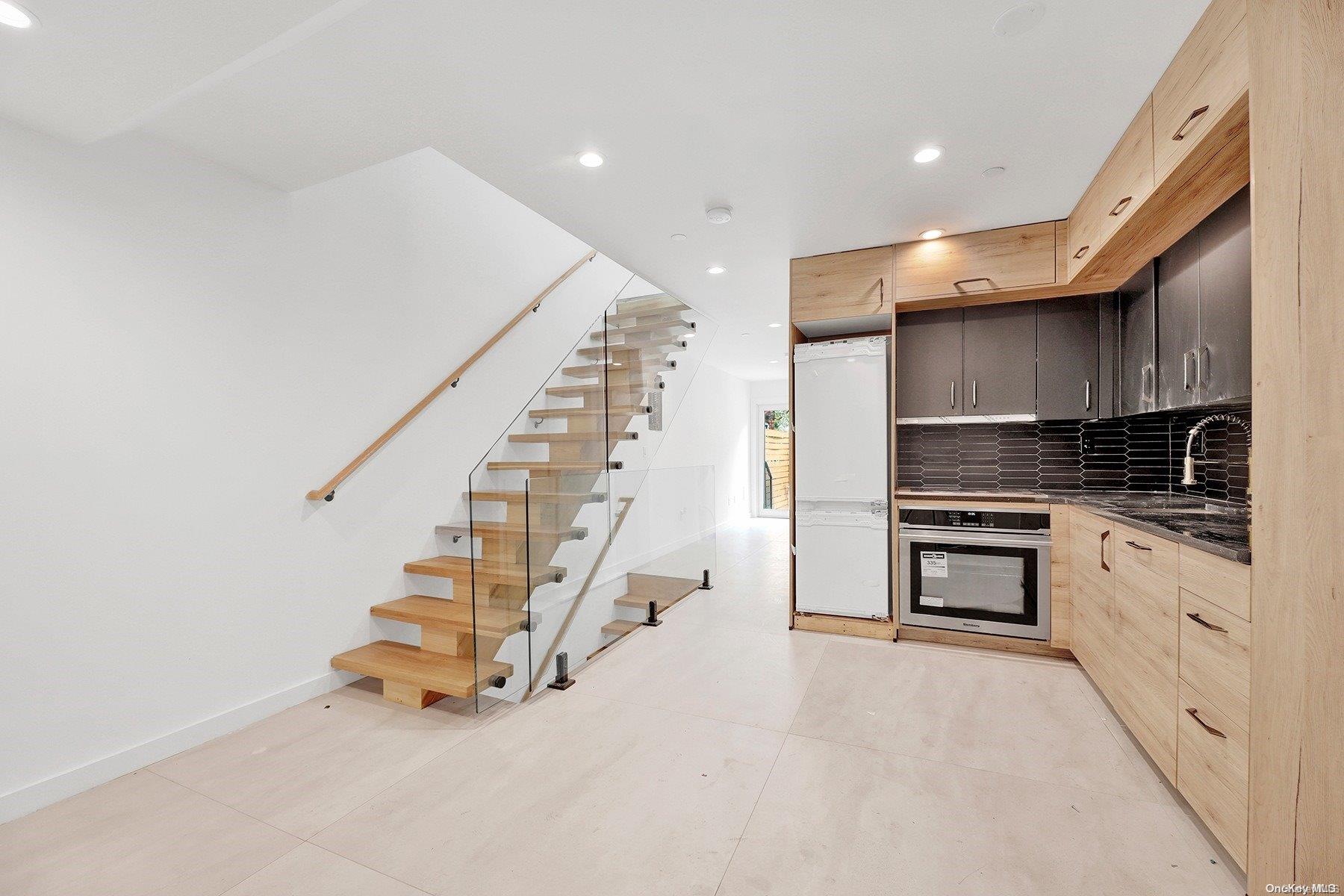 1511 Pacific Street Brooklyn, NY 11213 - Photo 21 of 31 a kitchen with cabinets and a stove