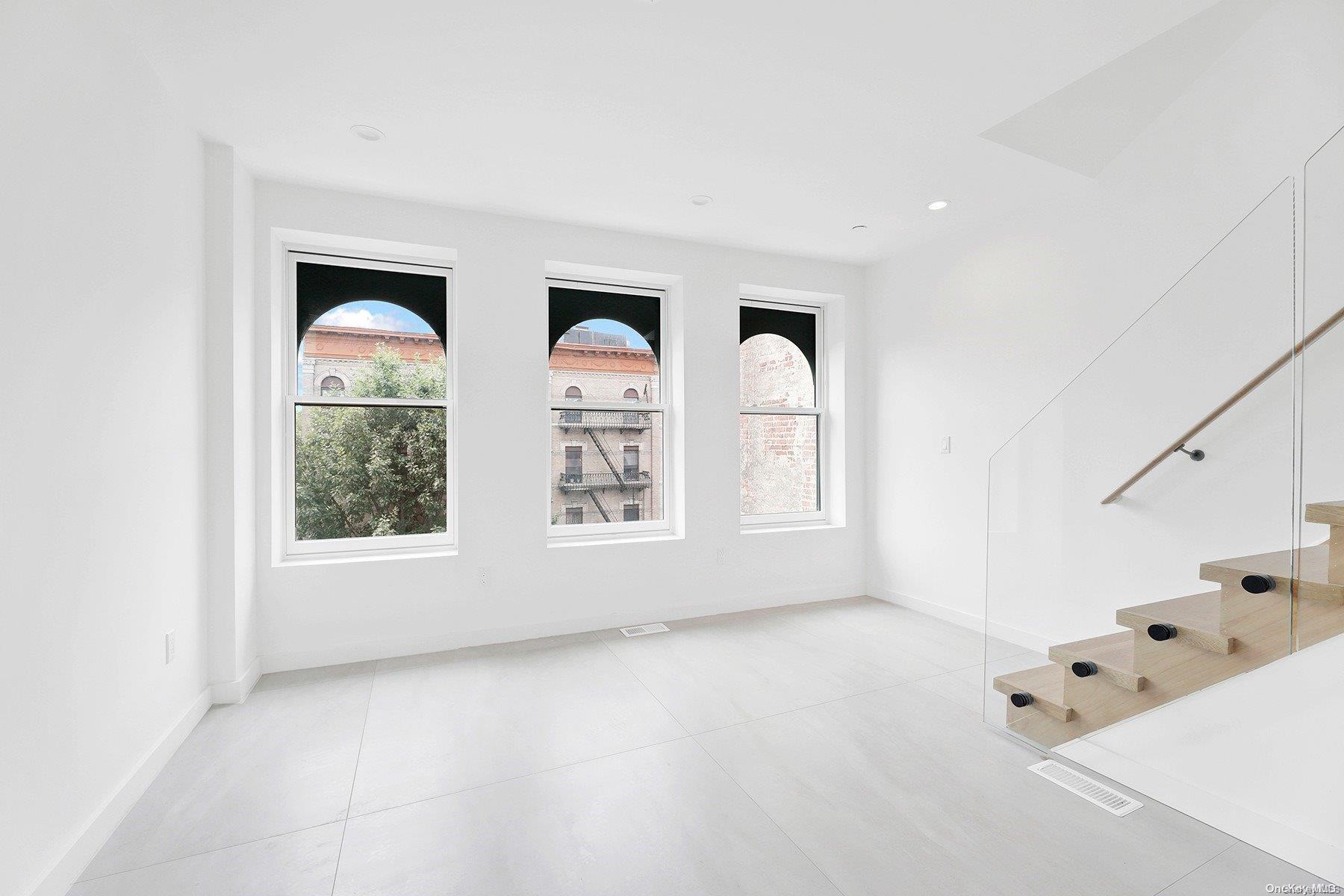 1511 Pacific Street Brooklyn, NY 11213 - Photo 22 of 31 a view of an empty room with a window