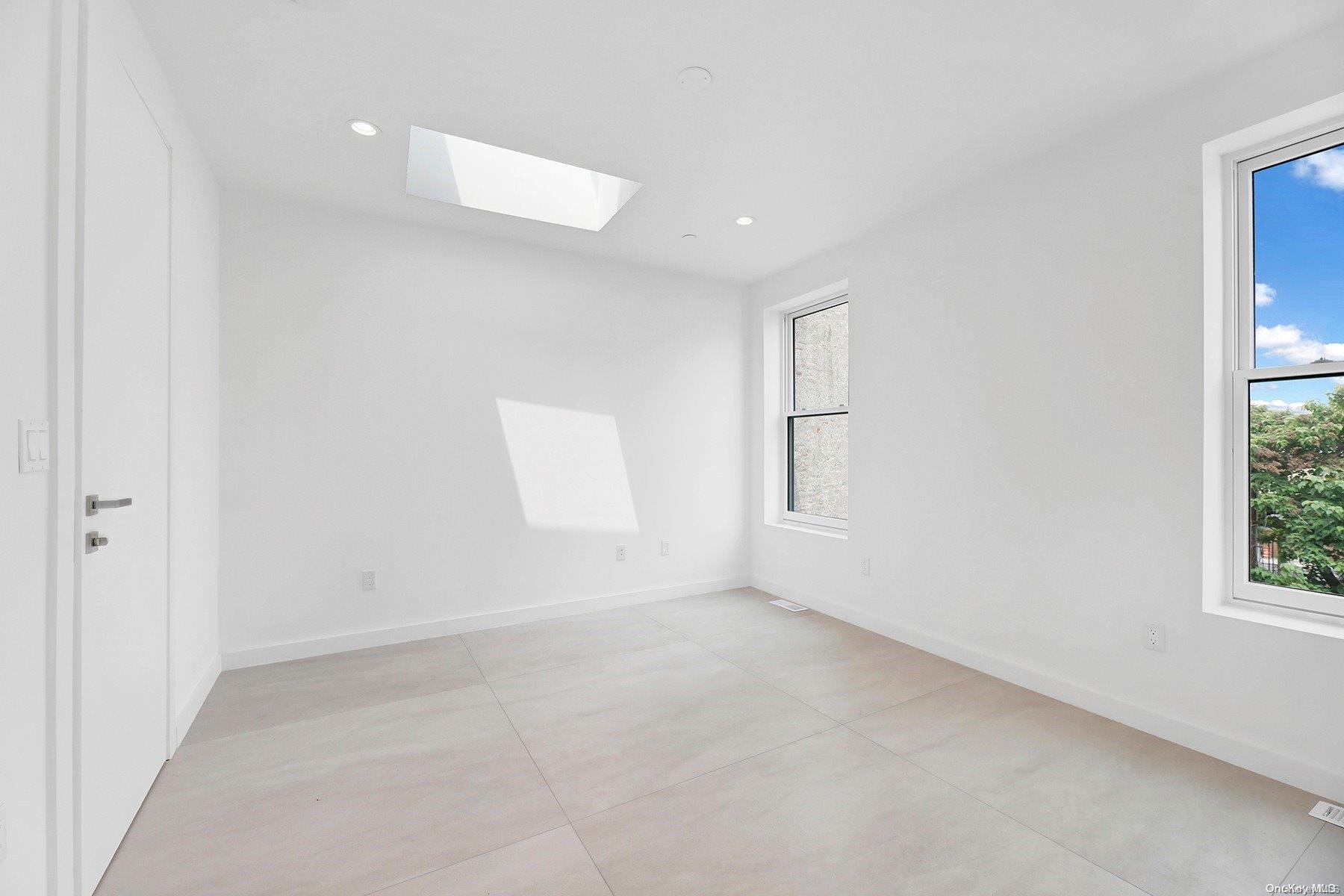 1511 Pacific Street Brooklyn, NY 11213 - Photo 28 of 31 wooden floor in an empty room with a window
