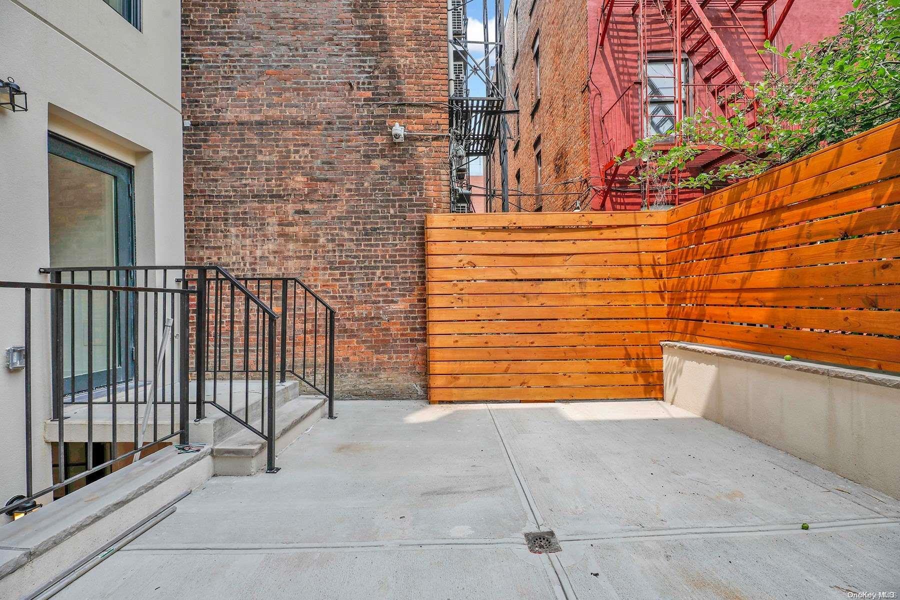 1511 Pacific Street Brooklyn, NY 11213 - Photo 31 of 31 a view of a brick house with an empty space