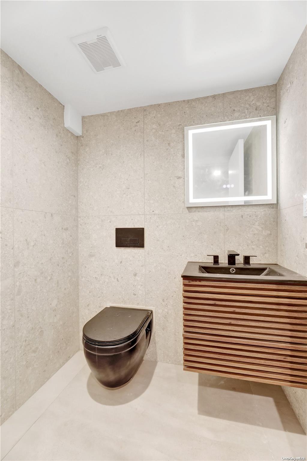 1511 Pacific Street Brooklyn, NY 11213 - Photo 5 of 31 a bathroom with a sink a toilet and mirror