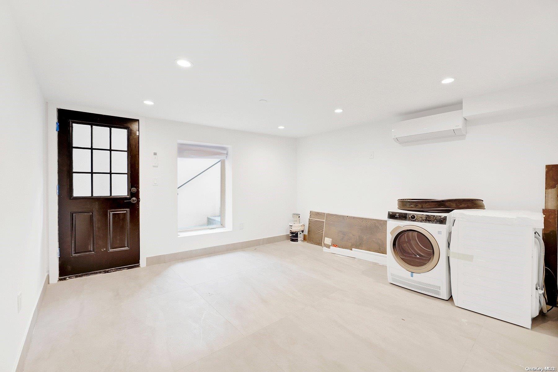 1511 Pacific Street Brooklyn, NY 11213 - Photo 6 of 31 a view of livingroom with washer and dryer