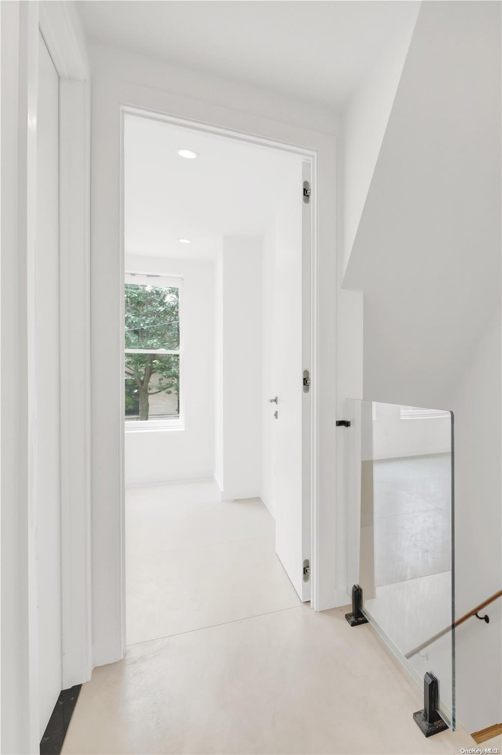 1511 Pacific Street Brooklyn, NY 11213 - Photo 9 of 31 a view of a livingroom with wooden floor and a window
