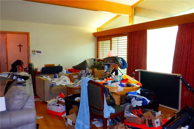 a very nice looking room with many windows and furniture