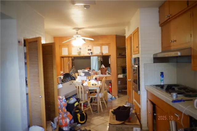 a view of a kitchen with appliances and cabinets