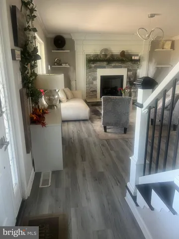 a kitchen with a stove and white cabinets