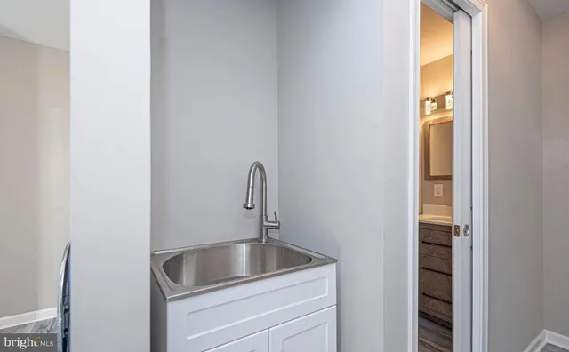 a bedroom with a bed and a night stand