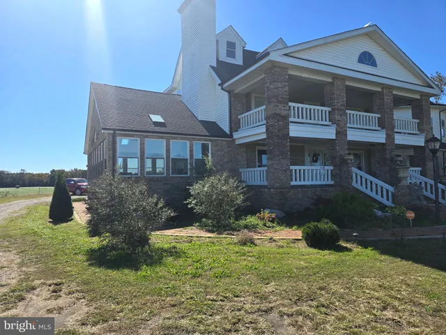 a aerial view of a house with a yard