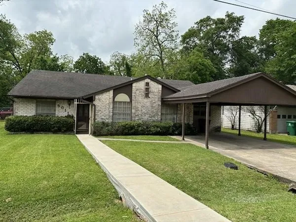 a front view of a house with a yard and porch