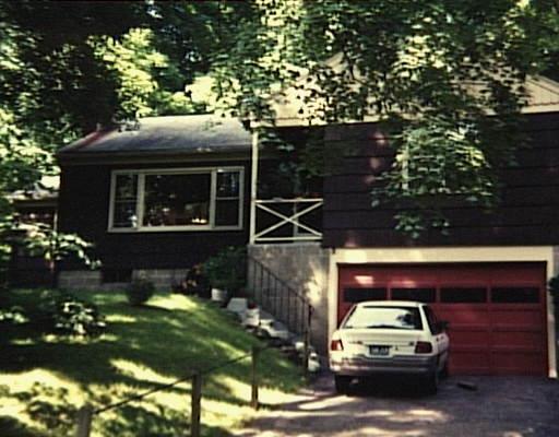 27 Hanover Road Newtown, CT 06470 - Photo 1 of 1 a car parked in front of a house