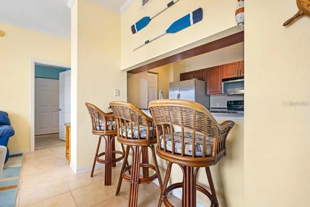 a view of a dining room with furniture and a window
