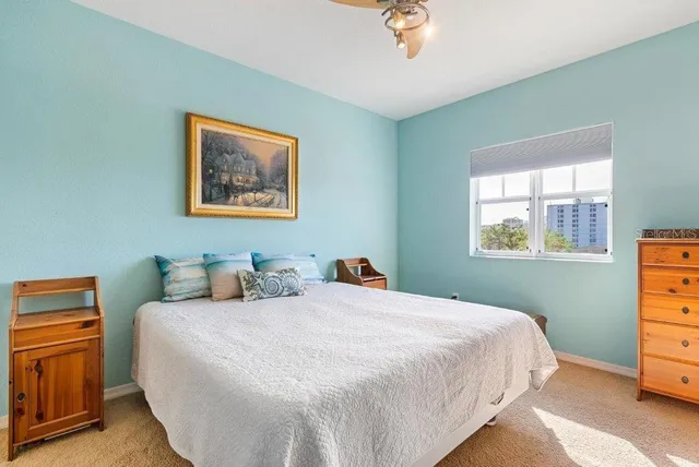 a bedroom with a bed and a dresser