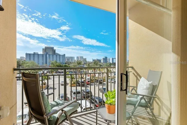 a view of a balcony with chairs