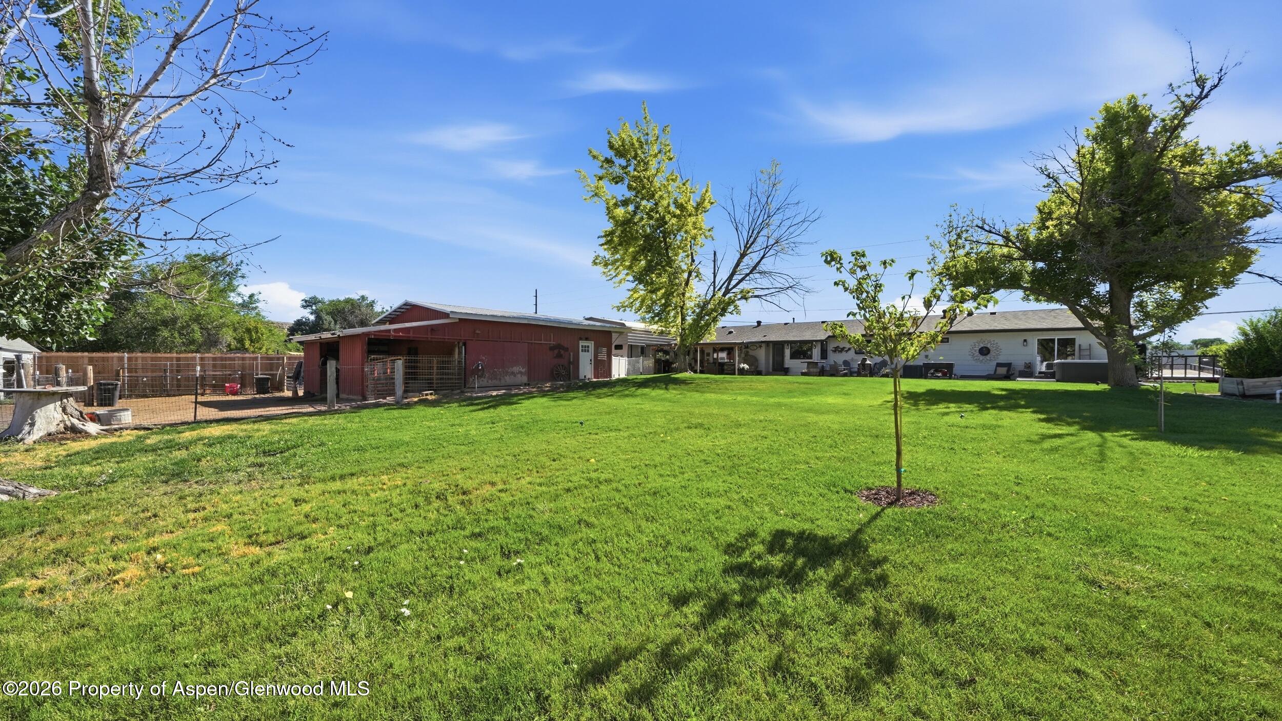 445 South Camp Road Grand Junction, CO 81507 - Photo 32 of 37 a backyard of a house with table and chairs