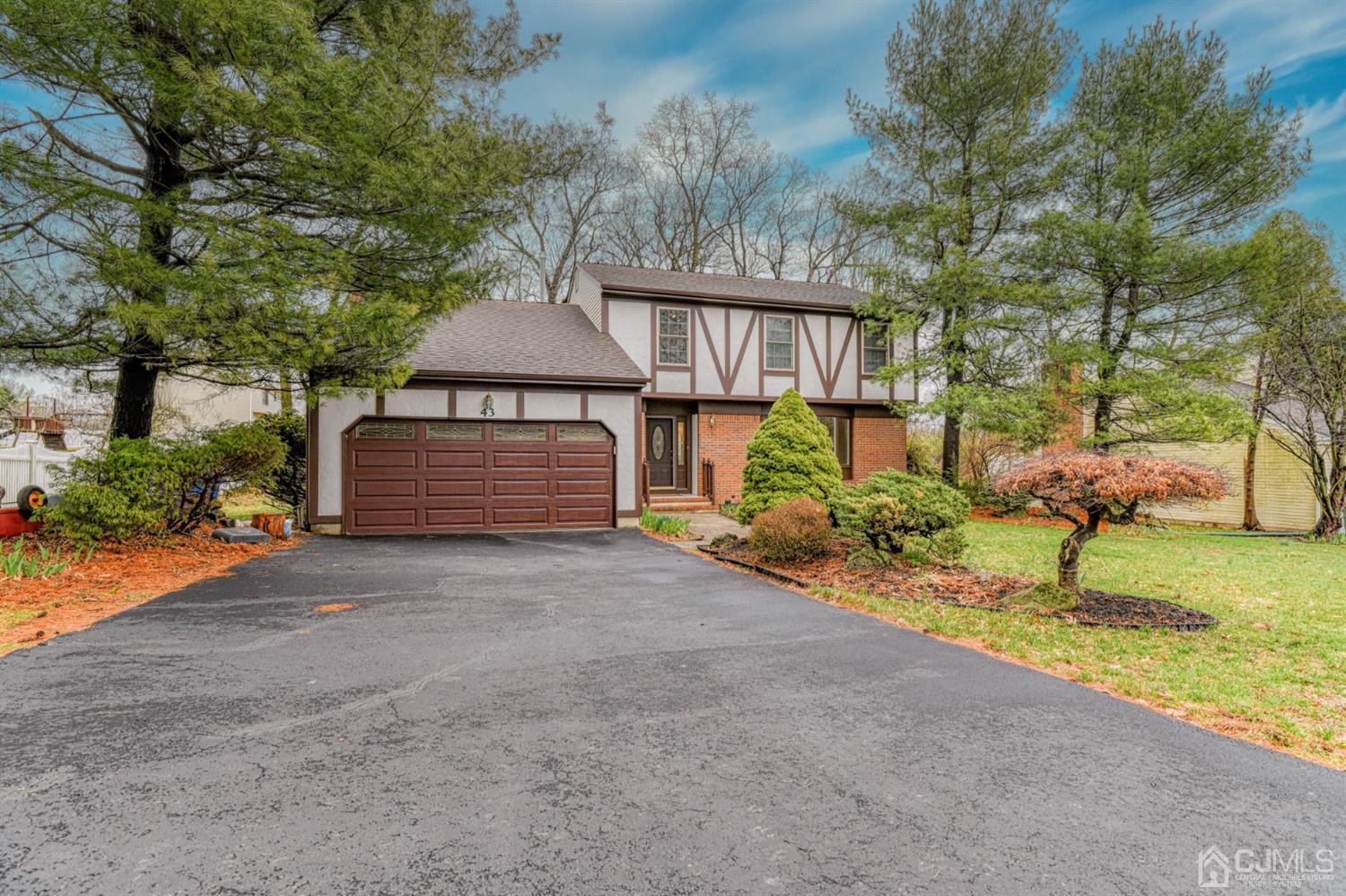 43 Pinecrest Road Somerset, NJ 08873 - Photo 1 of 34 a front view of a house with garden