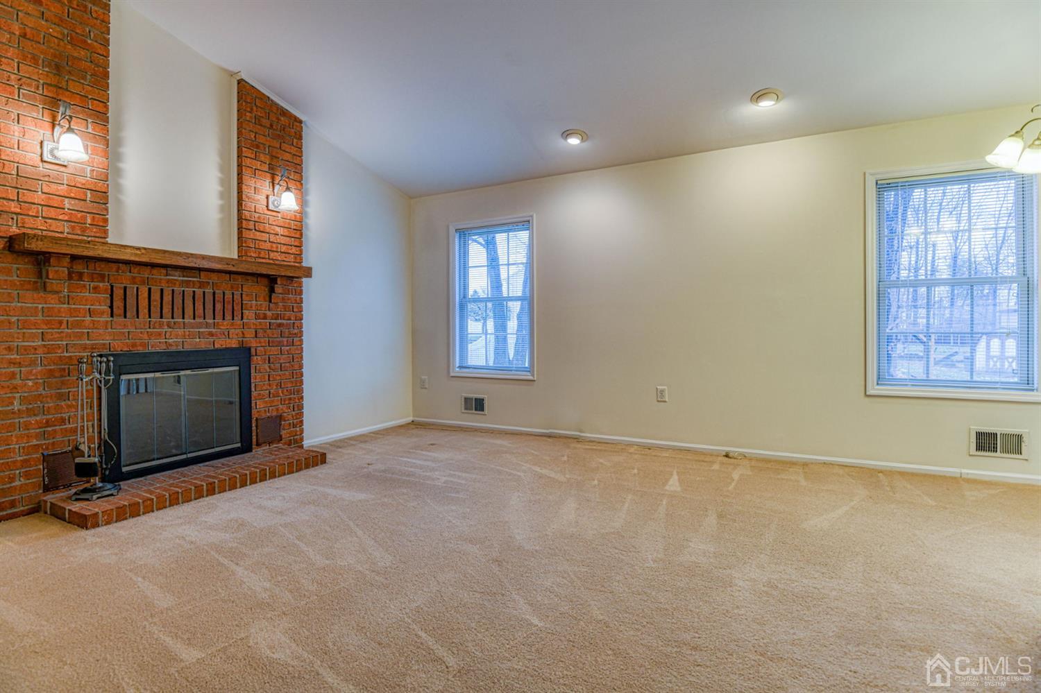 43 Pinecrest Road Somerset, NJ 08873 - Photo 17 of 34 an empty room with windows and fireplace