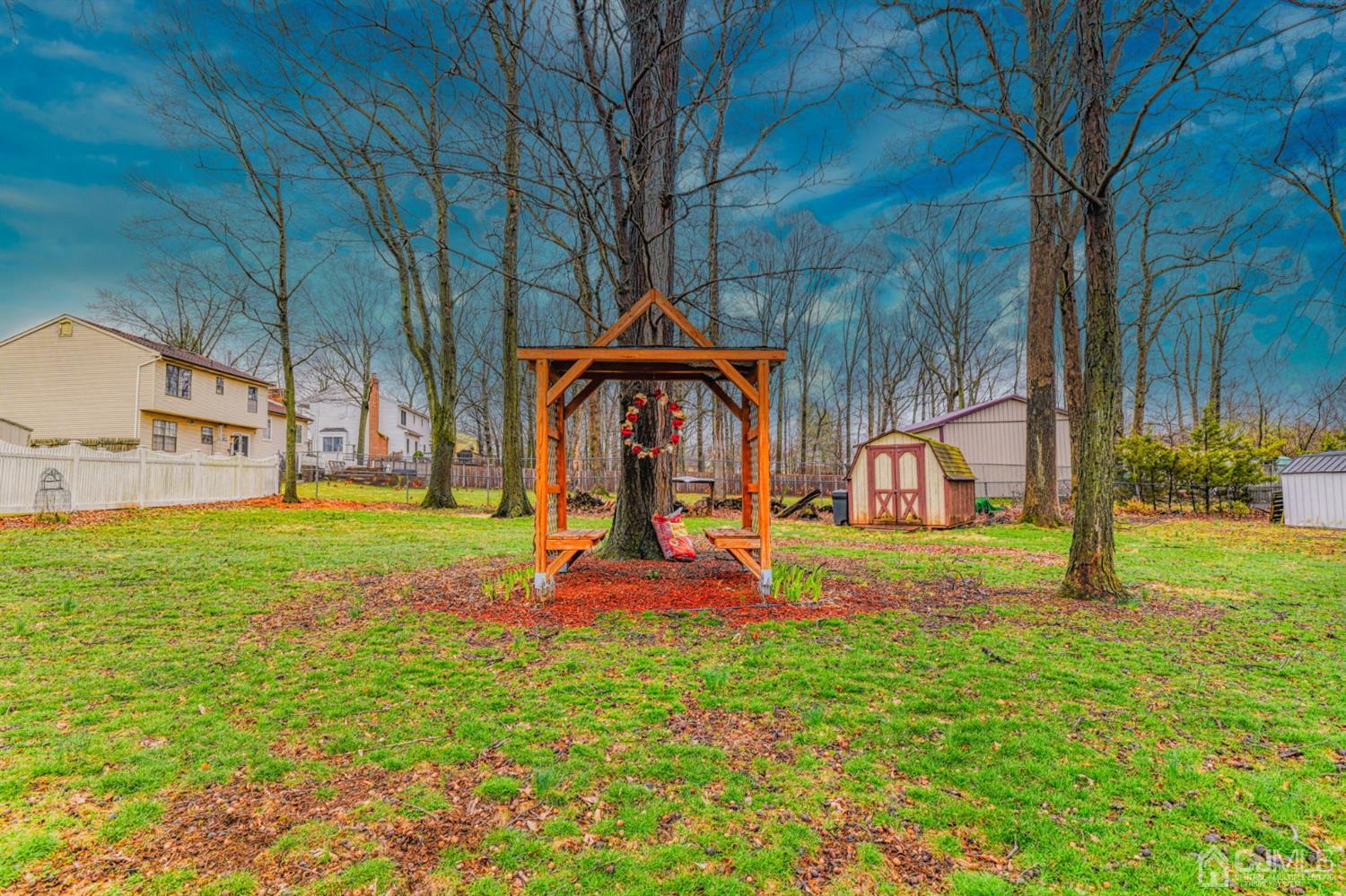 43 Pinecrest Road Somerset, NJ 08873 - Photo 32 of 34 a backyard of a house with table and chairs