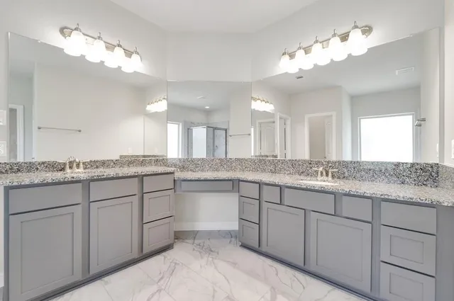 a view of an empty room and window with a ceiling fan