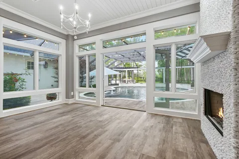 a view of a wooden door and brick wall
