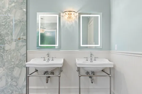 a white bath tub sitting next to a window