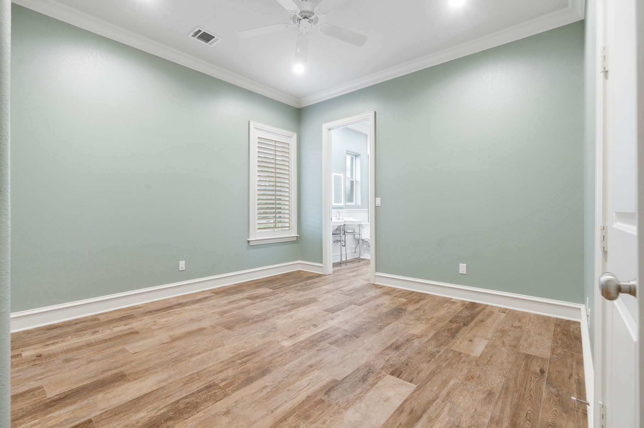 27614 Little Fox Crest Spring, TX 77386 - Photo 30 of 49 an empty room with wooden floor and windows
