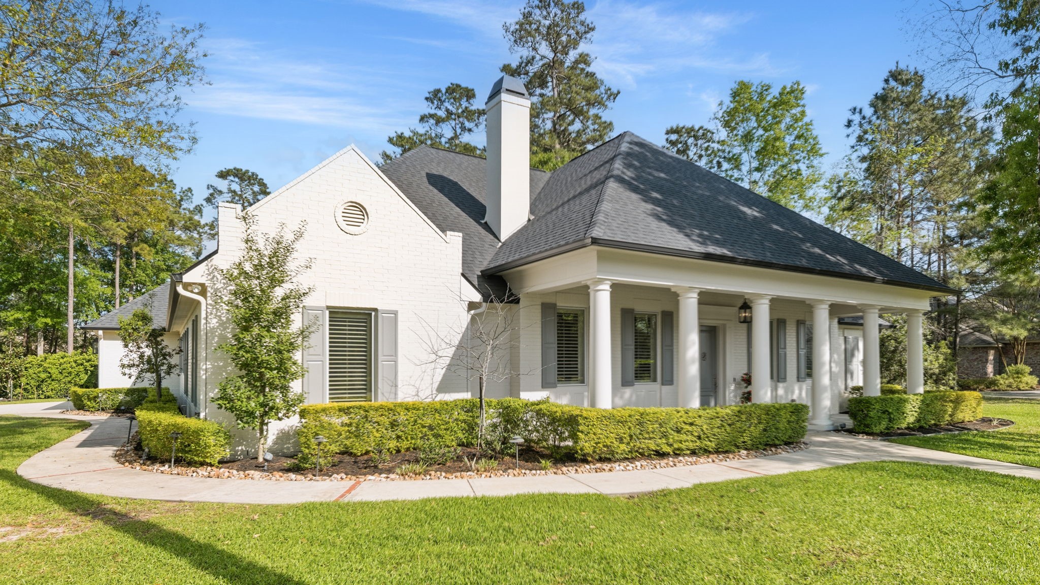 27614 Little Fox Crest Spring, TX 77386 - Photo 4 of 49 a view of a white house with a small yard and large trees