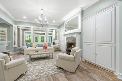 a living room with a fireplace and a fireplace