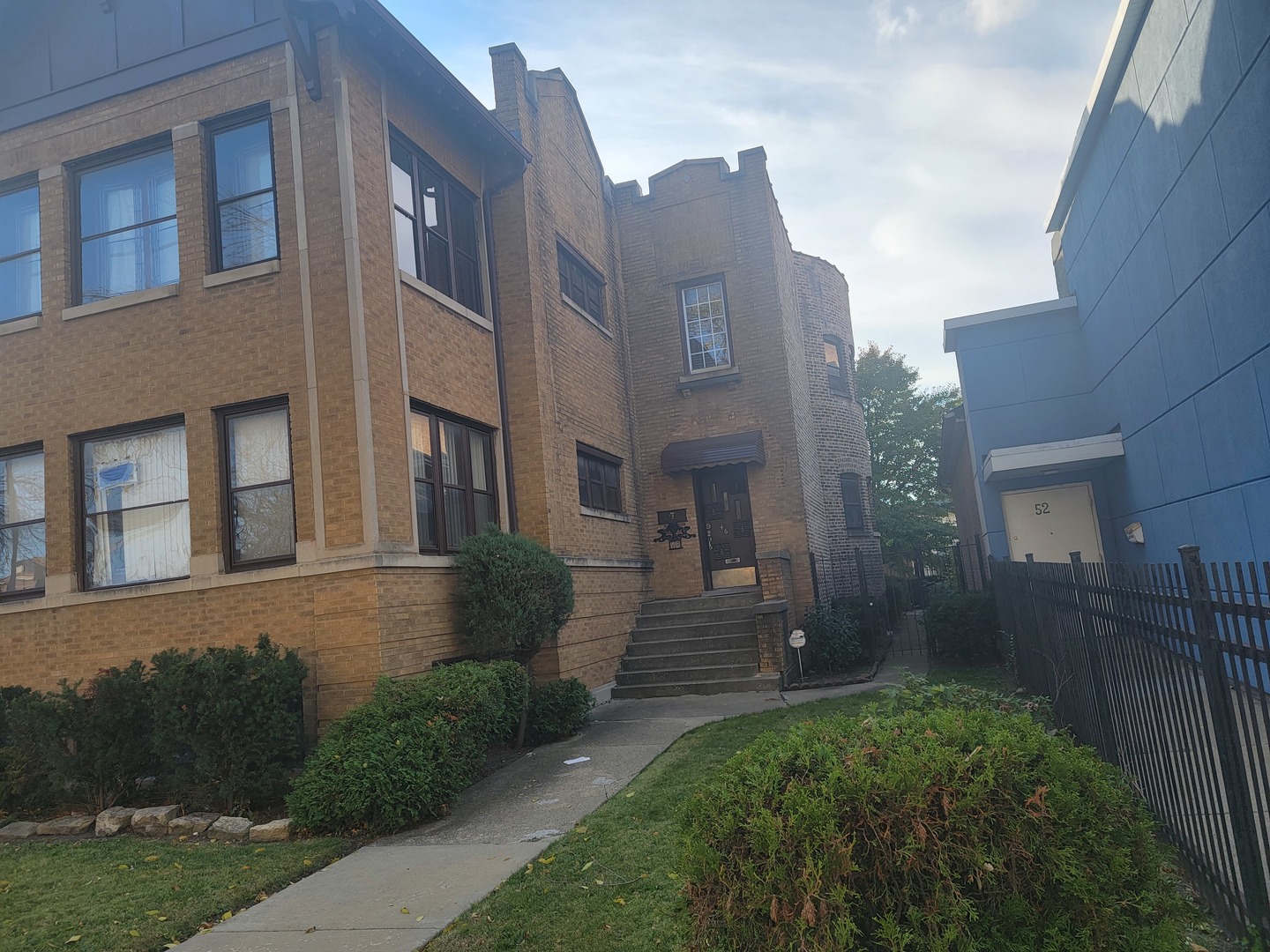46 North Central Avenue Chicago, IL 60644 - Photo 3 of 24 a front view of a house with a yard
