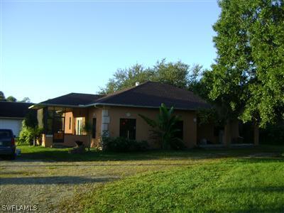 11630 Ruth Road North Fort Myers, FL 33917 - Photo 1 of 10 a front view of a house with a yard