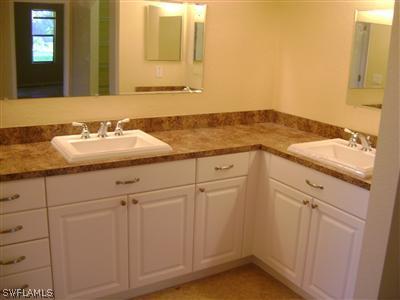 11630 Ruth Road North Fort Myers, FL 33917 - Photo 6 of 10 a bathroom with a sink and vanity