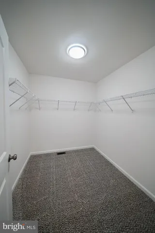 a view of a room with racks on the wall