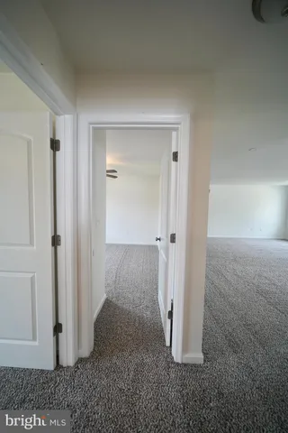 a view of a room with a hallway