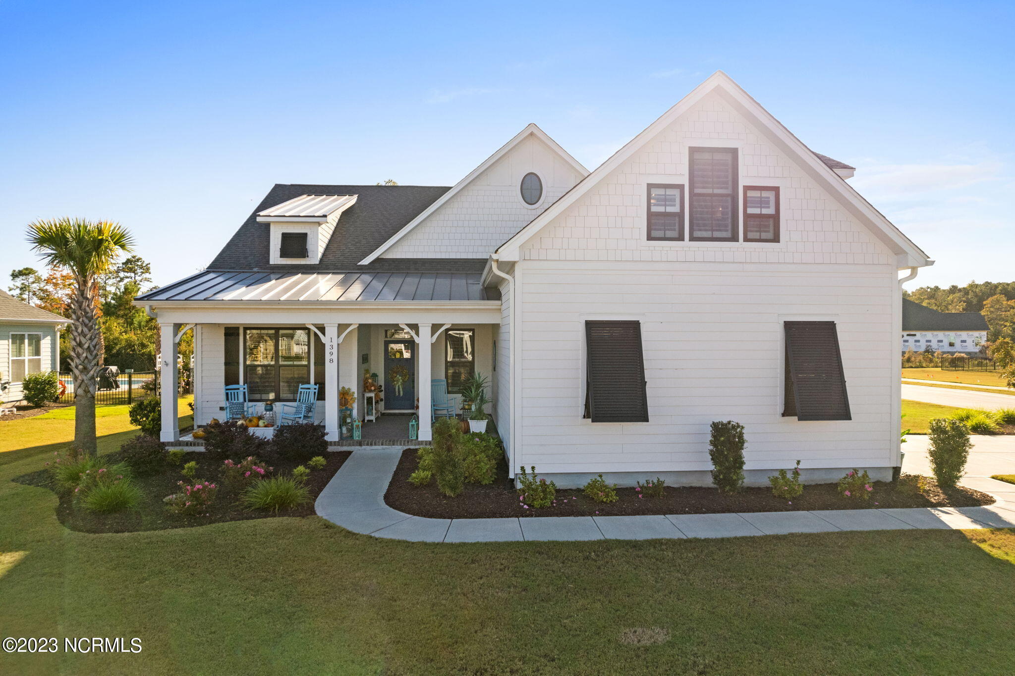 1398 Long Pond Road Southwest Ocean Isle Beach, NC 28469 - Photo 1 of 48 Stunning corner lot with classic white exterior / ASHTON Model