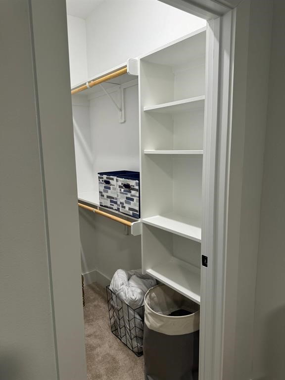 3610 Dreyfus Street, Unit A Houston, TX 77021 - Photo 19 of 20 a room with a wooden floor and shelf