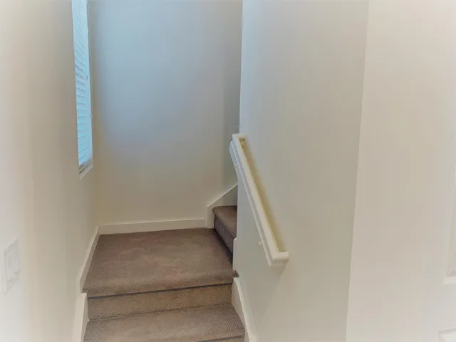 a view of hallway with stairs