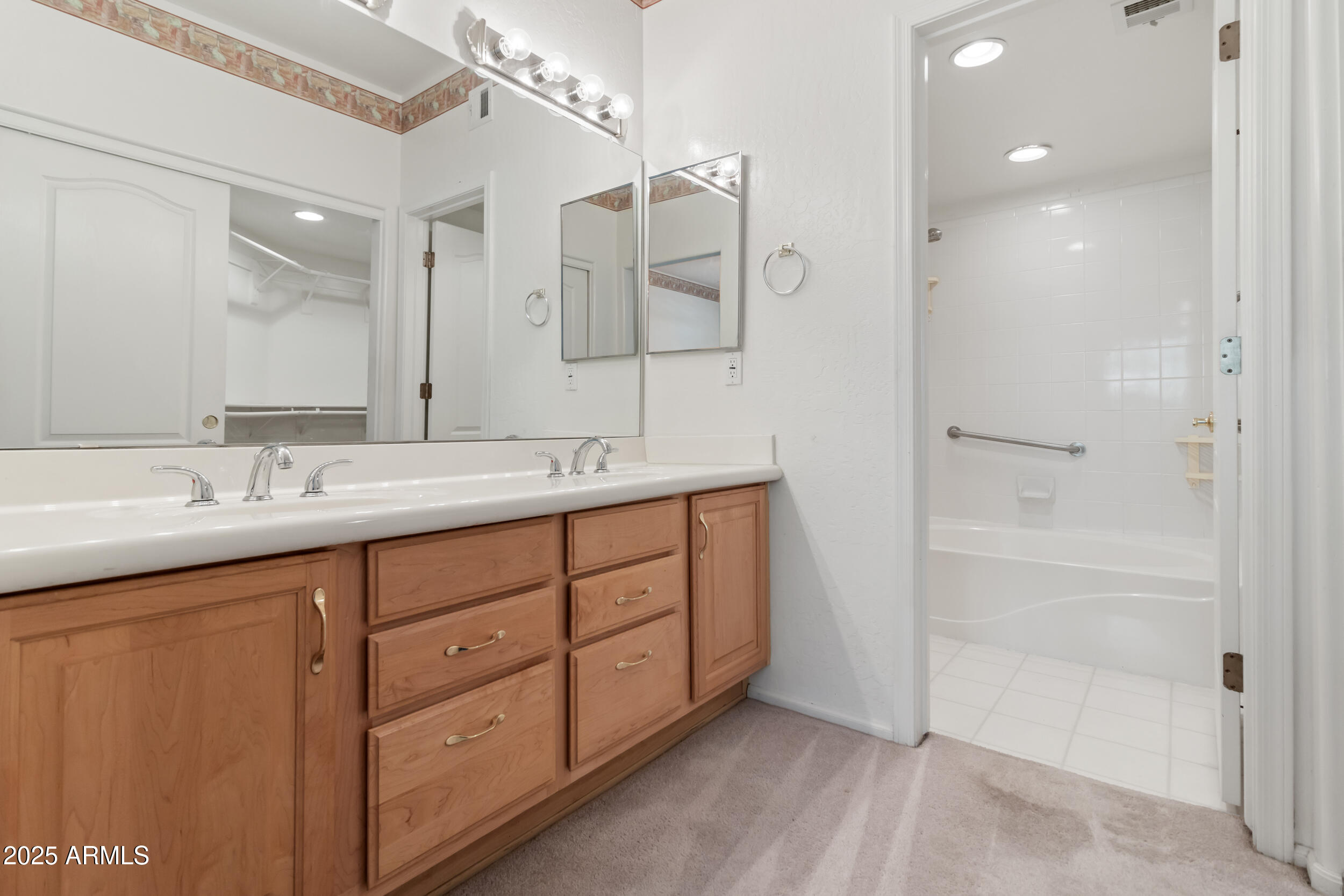 1747 East Northern Avenue, Unit 104 Phoenix, AZ 85020 - Photo 12 of 19 a bathroom with a double vanity sink and mirror