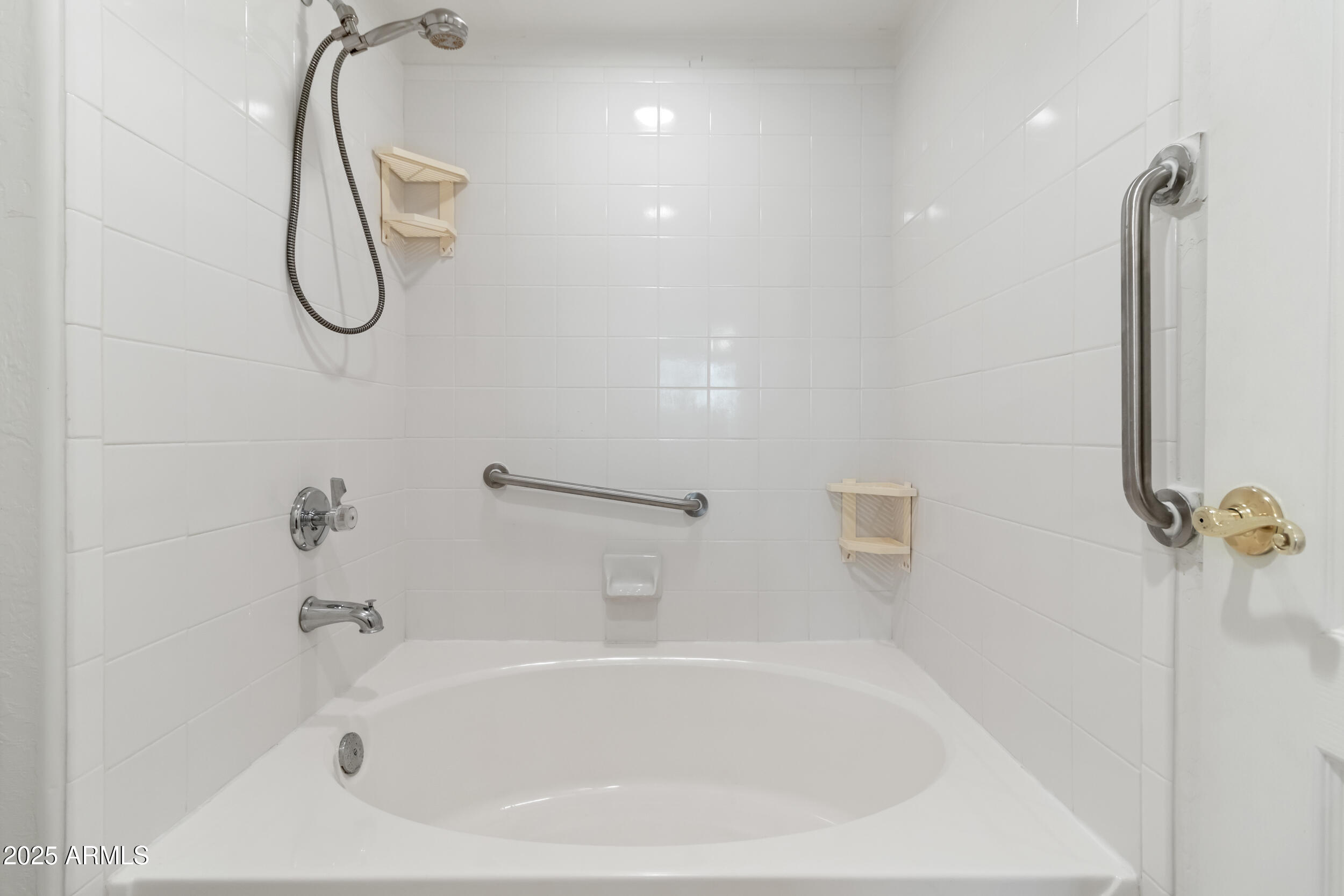 1747 East Northern Avenue, Unit 104 Phoenix, AZ 85020 - Photo 13 of 19 a bathroom with a bath tub with a shower