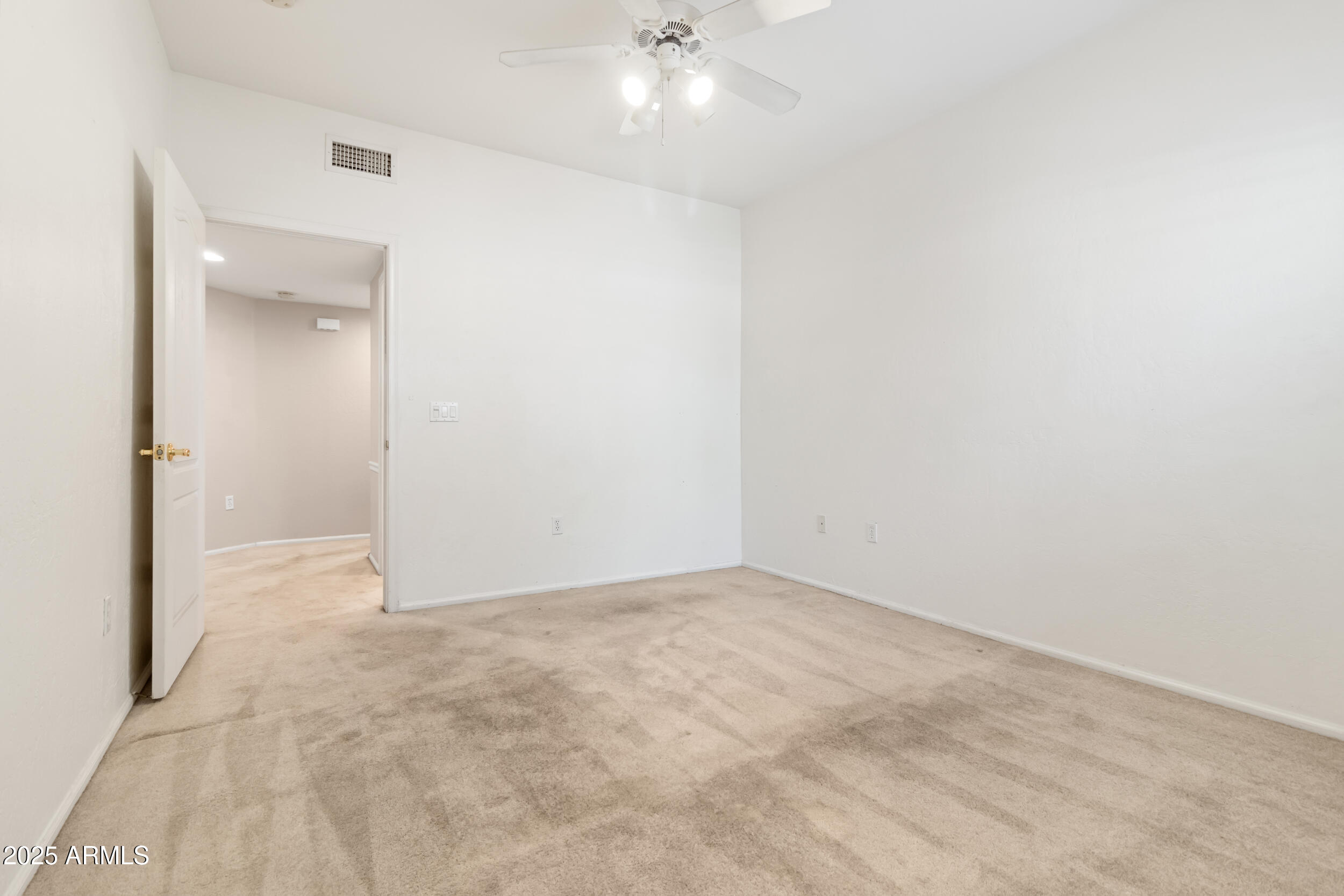 1747 East Northern Avenue, Unit 104 Phoenix, AZ 85020 - Photo 15 of 19 an empty room with a bathroom