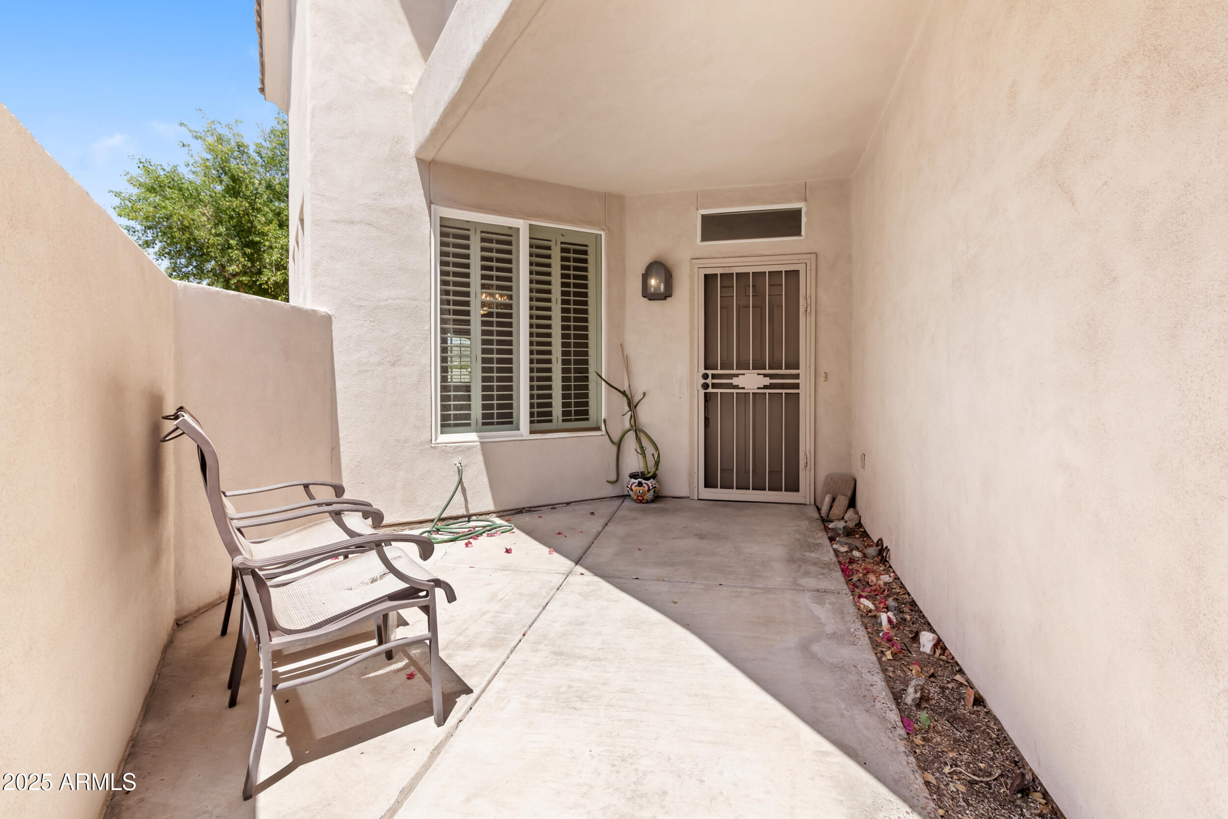 1747 East Northern Avenue, Unit 104 Phoenix, AZ 85020 - Photo 19 of 19 a view of two chairs in the patio