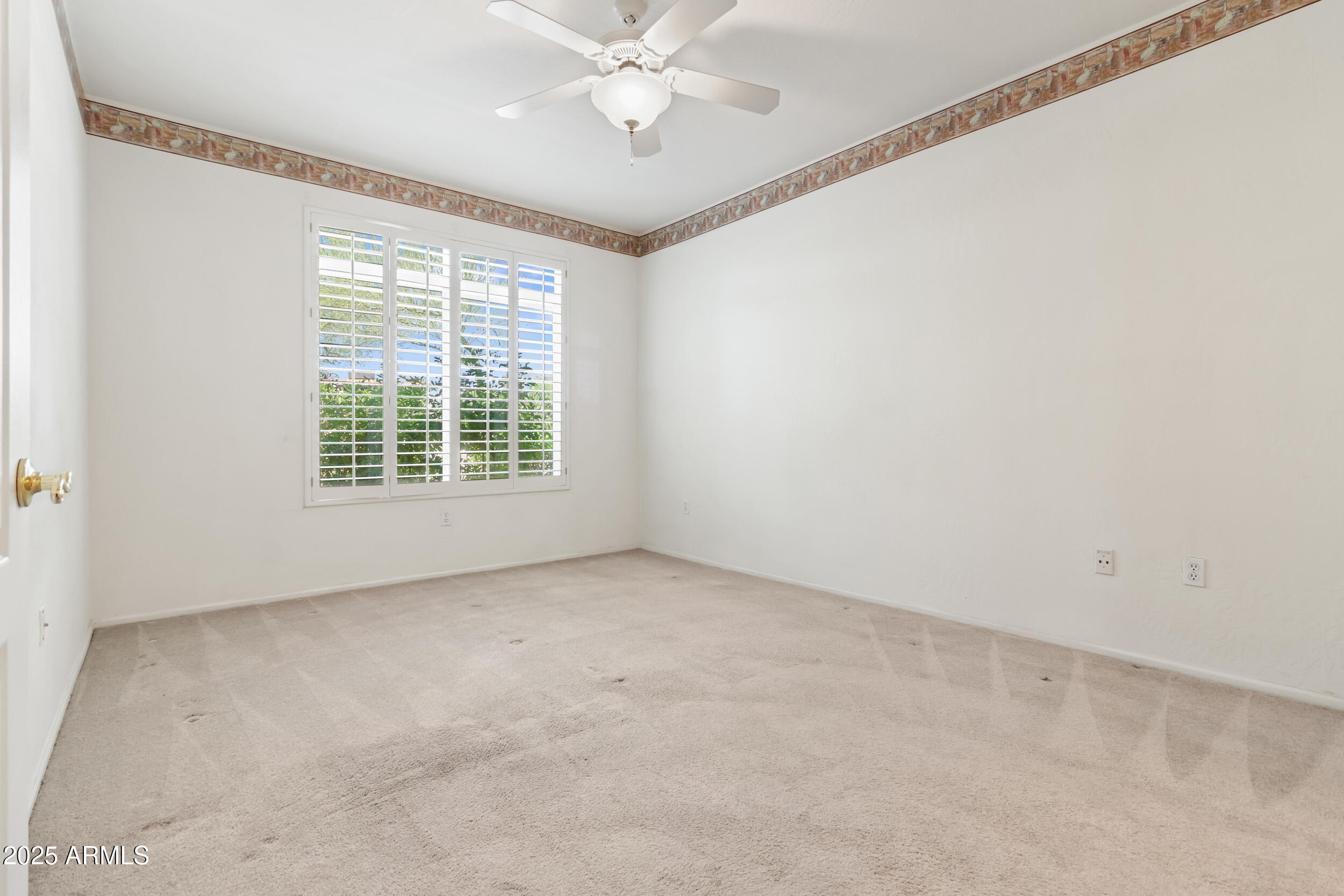 1747 East Northern Avenue, Unit 104 Phoenix, AZ 85020 - Photo 9 of 19 an empty room with a window