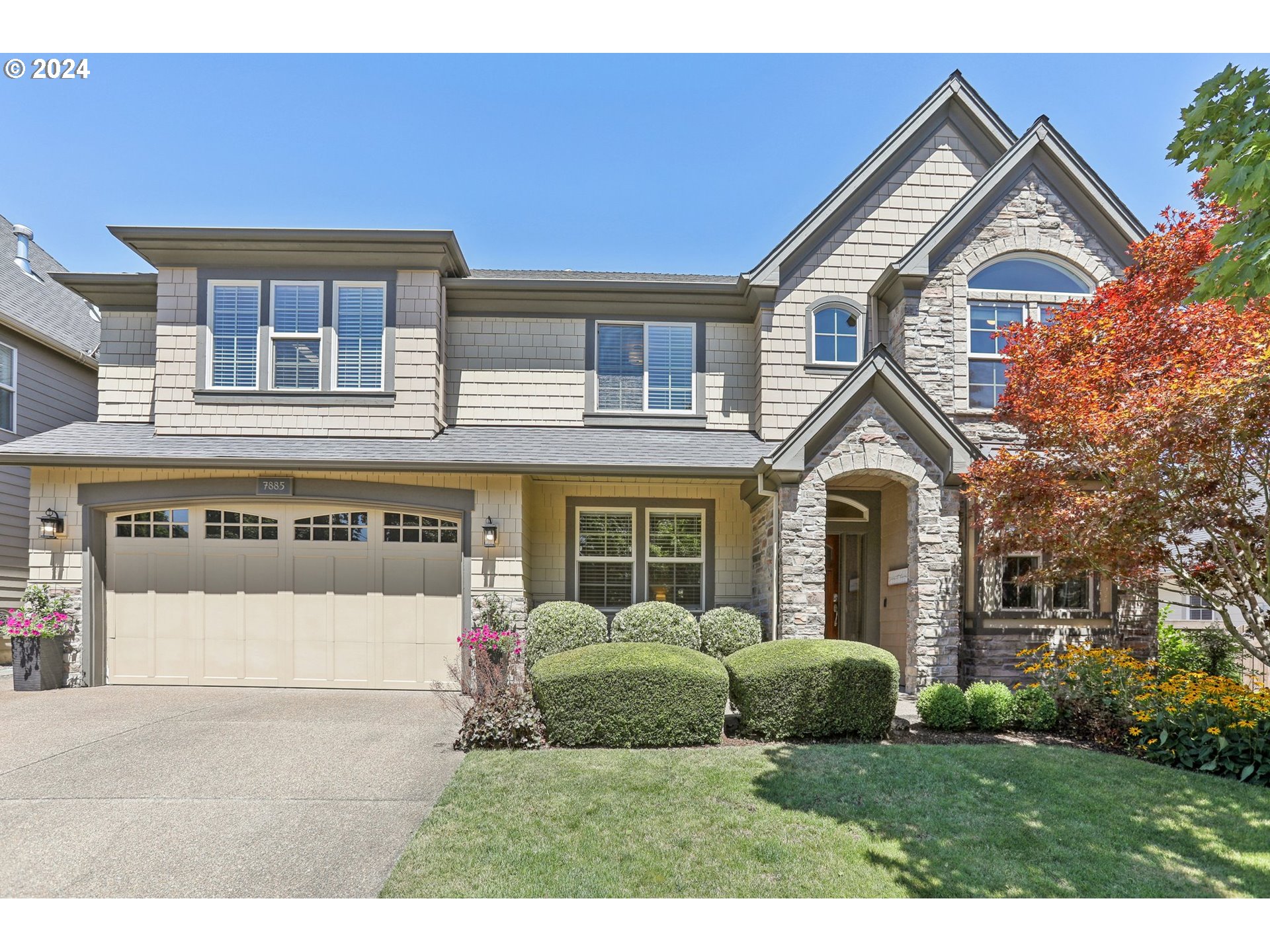 7885 Southwest Daybreak Street Wilsonville, OR 97070 - Photo 1 of 48 a front view of a house with a yard and garage