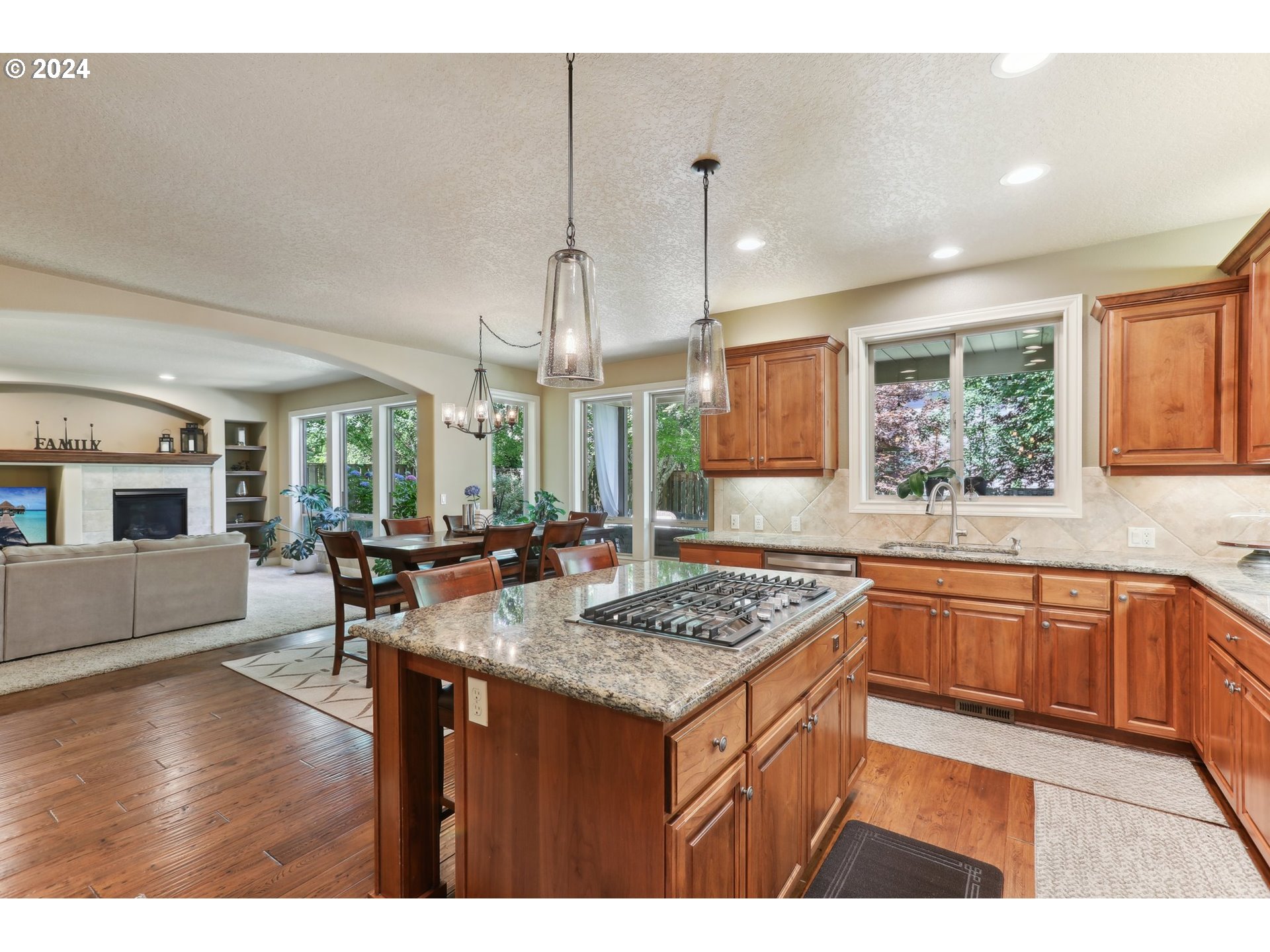 7885 Southwest Daybreak Street Wilsonville, OR 97070 - Photo 11 of 48 a kitchen with a counter top space a sink appliances and cabinets