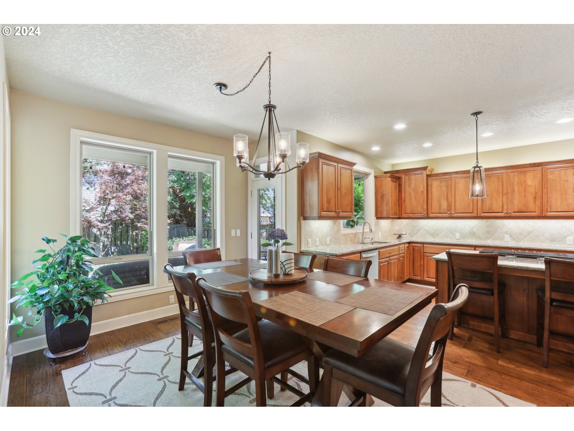 7885 Southwest Daybreak Street Wilsonville, OR 97070 - Photo 13 of 48 a dining room with a table or chairs and a dining table