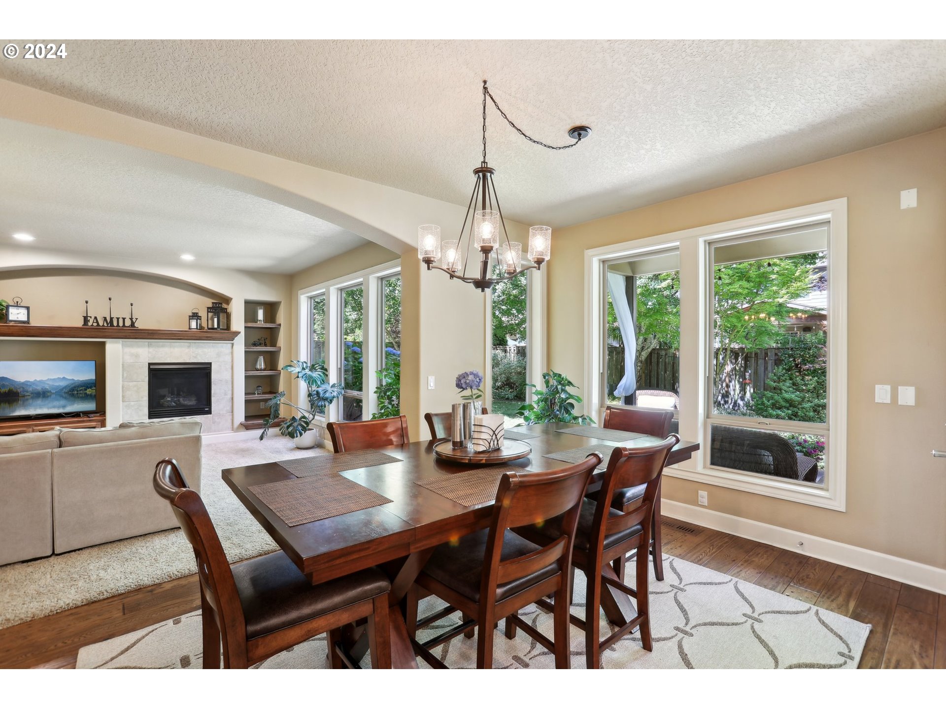 7885 Southwest Daybreak Street Wilsonville, OR 97070 - Photo 14 of 48 a view of a dining room with furniture window and wooden floor