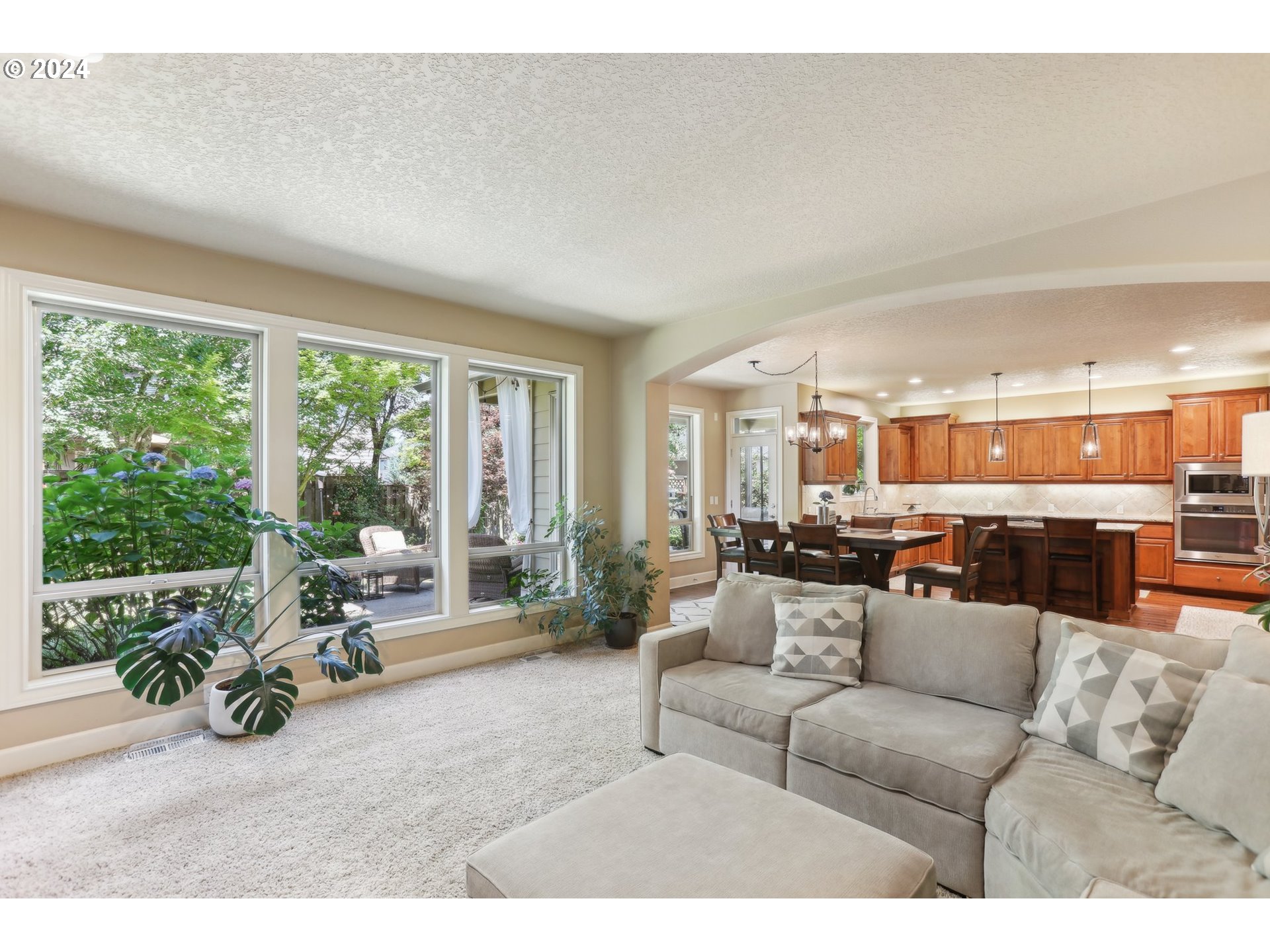 7885 Southwest Daybreak Street Wilsonville, OR 97070 - Photo 15 of 48 a living room with furniture and a large window