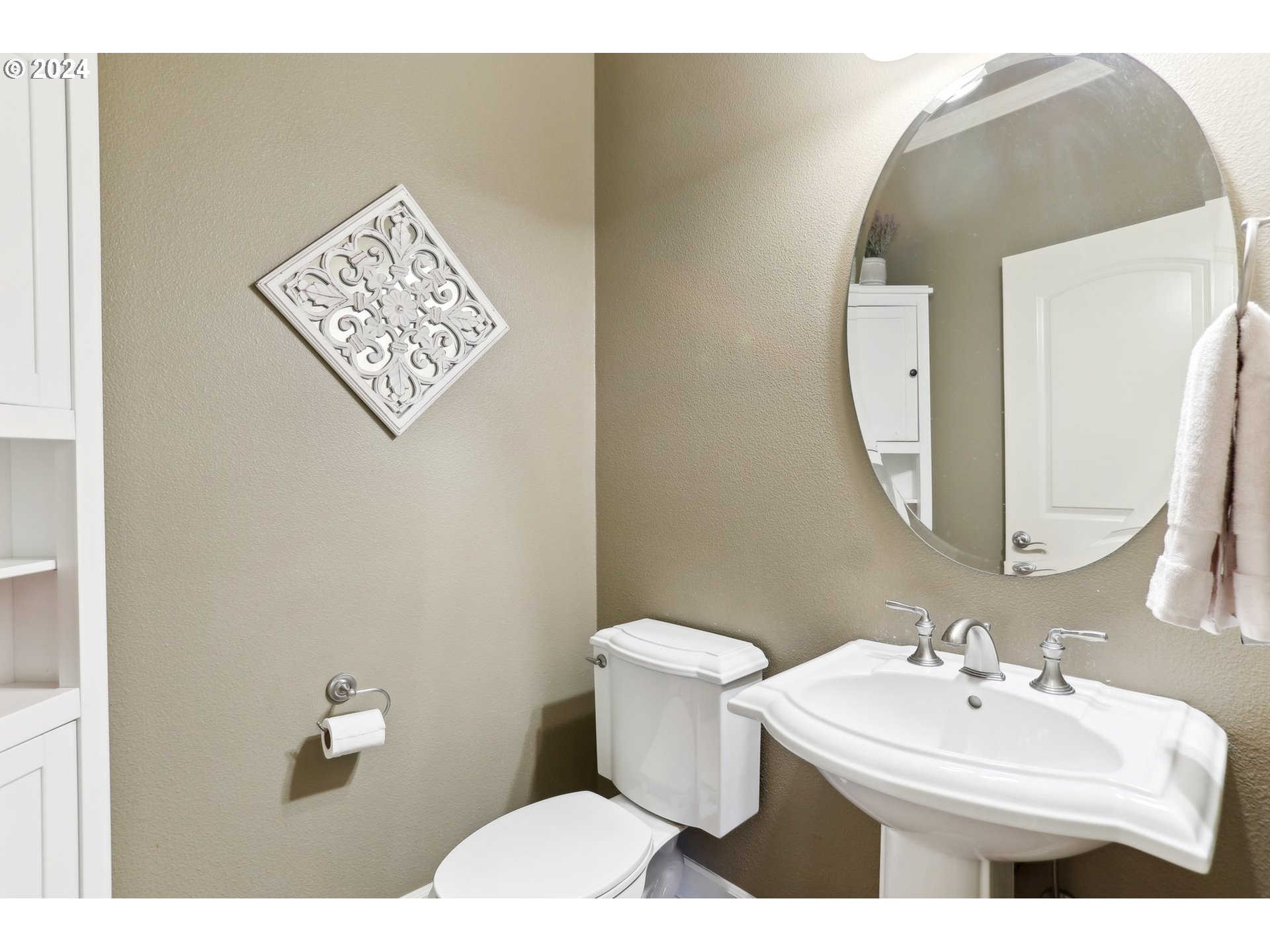 7885 Southwest Daybreak Street Wilsonville, OR 97070 - Photo 20 of 48 a bathroom with a toilet sink and mirror