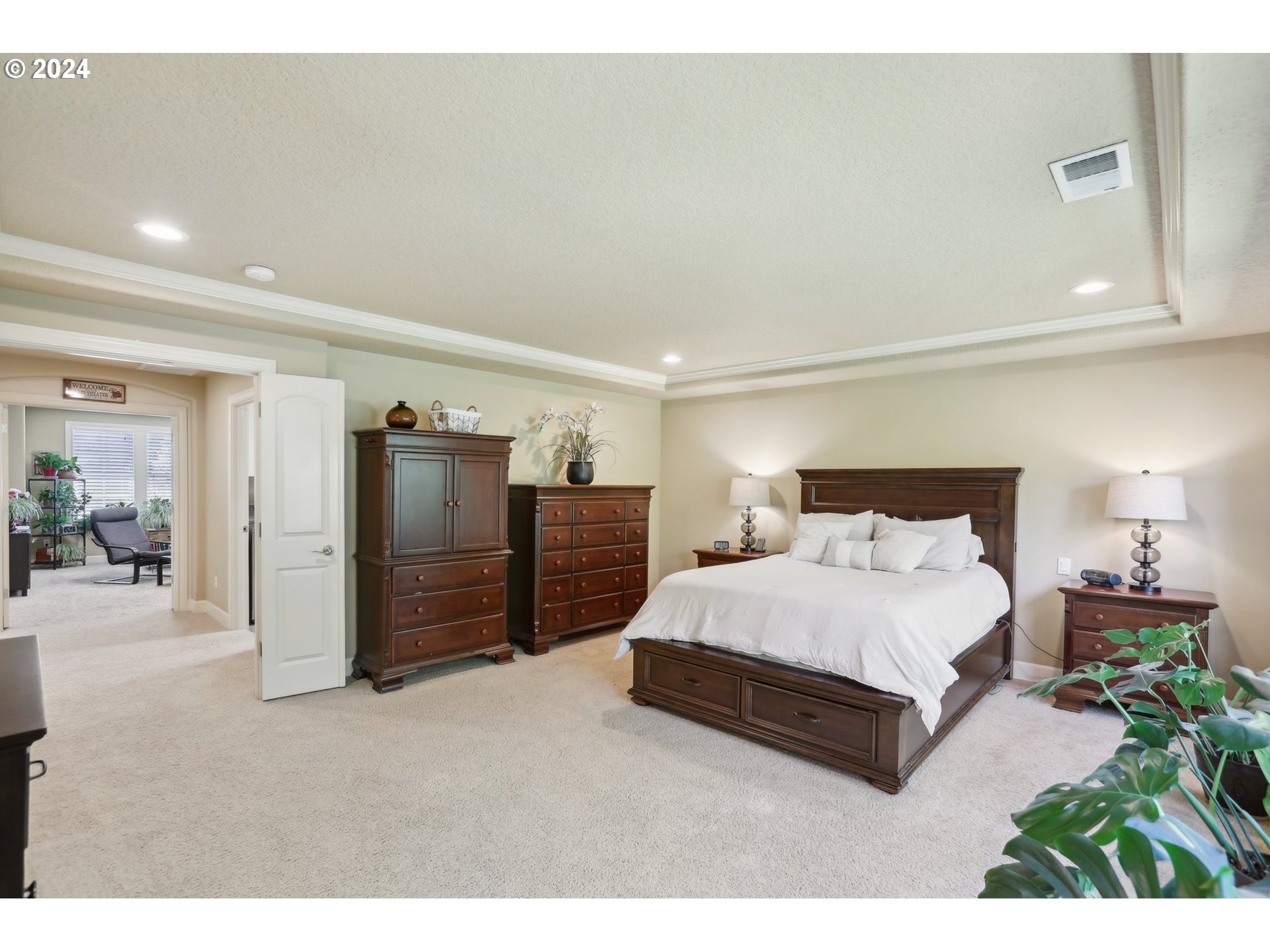 7885 Southwest Daybreak Street Wilsonville, OR 97070 - Photo 23 of 48 a spacious bedroom with a bed and a cabinets