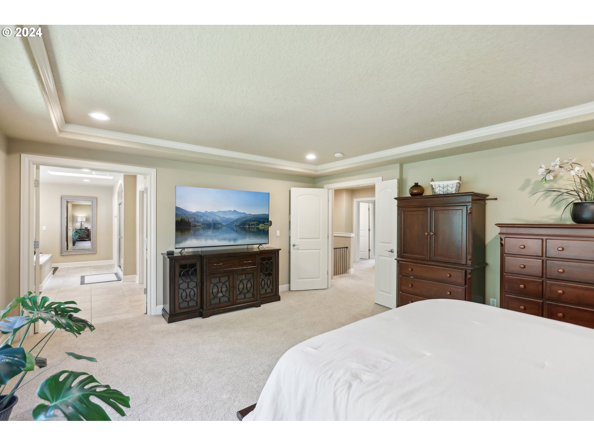 7885 Southwest Daybreak Street Wilsonville, OR 97070 - Photo 24 of 48 a bedroom with a bed and a television
