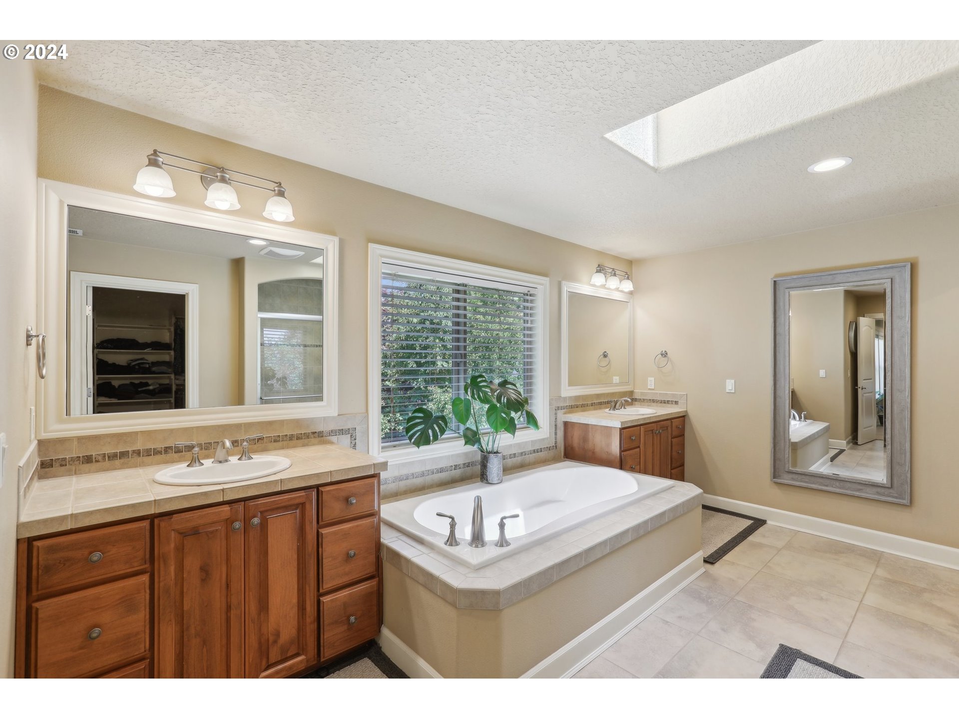7885 Southwest Daybreak Street Wilsonville, OR 97070 - Photo 25 of 48 a bathroom with a sink and a mirror